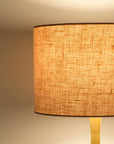 Blush pink linen lampshade illuminated at night